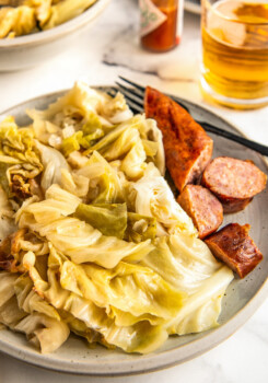 Dinner is served of cabbage and sausage.