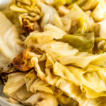 Close up of a plate of slow cooked cabbage.