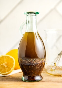 A jar filled with lemon balsamic vinaigrette.