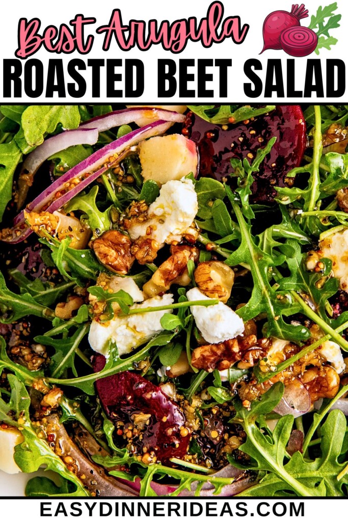 A roasted beet salad with goat cheese and arugula topped with a lemon balsamic vinaigrette dressing.