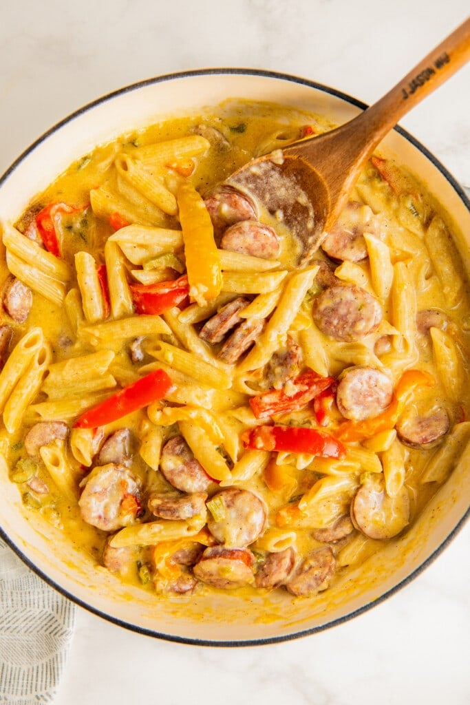 Add the pasta and stirring to combine with the creamy cajun sauce and sausage.