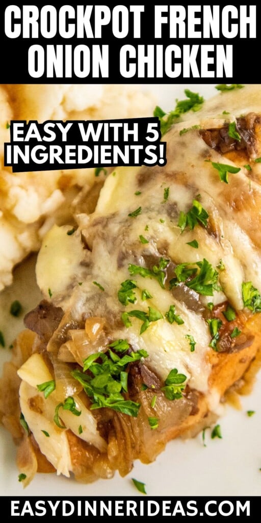 Crockpot French Onion Chicken with cheese and fresh herbs on top.