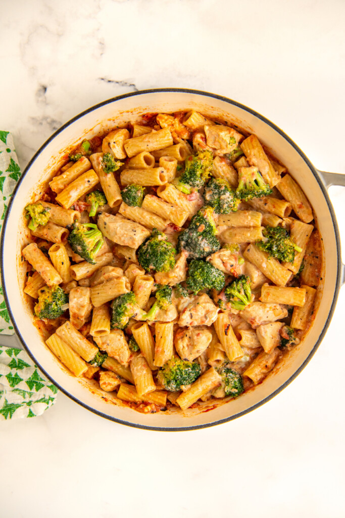 Melted cheese stirred into pasta with chicken and tender broccoli florets.