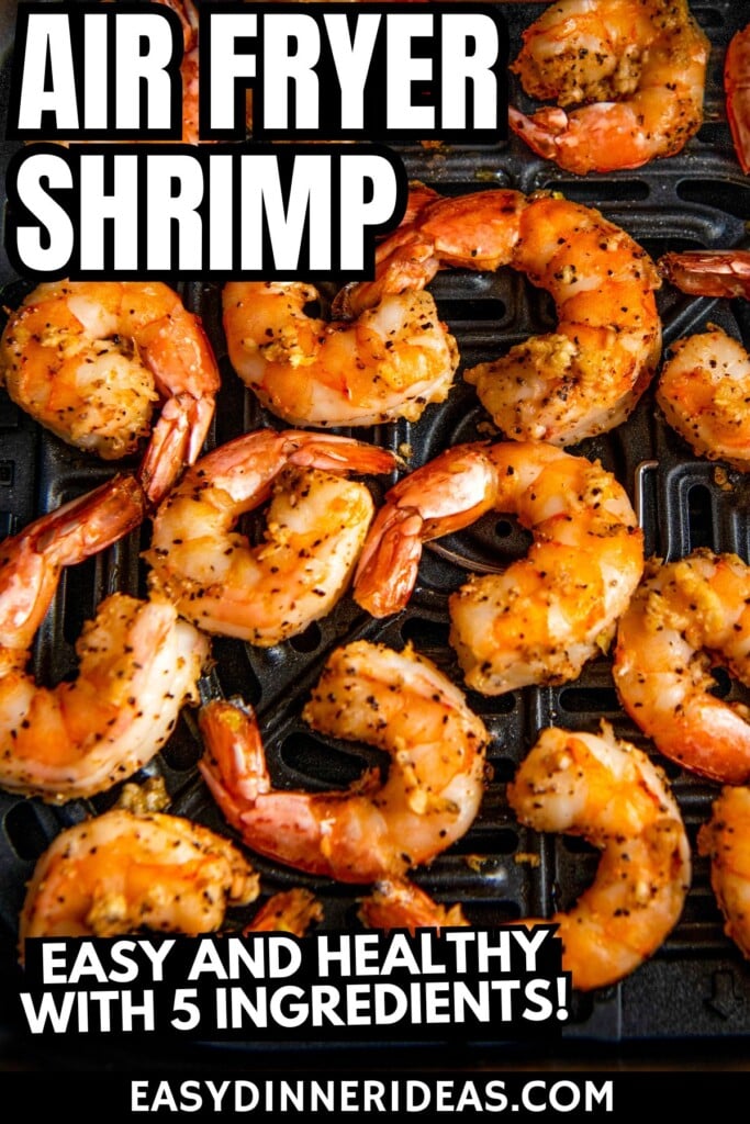 Juicy cooked shrimp in air fryer basket.