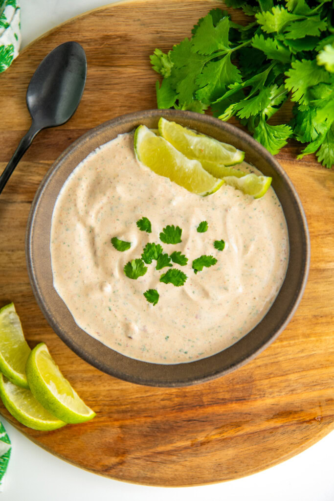 Creamy chipotle sauce in a bowl with fresh cilantro on top. 