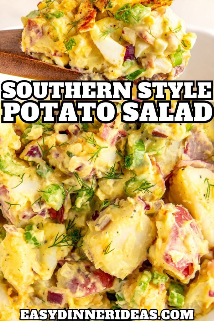 A bowl of Southern potato salad with red potatoes and hard boiled eggs being served with a wooden spoon.