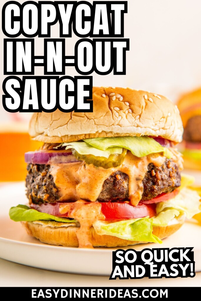A hamburger topped with copycat in and out burger sauce.