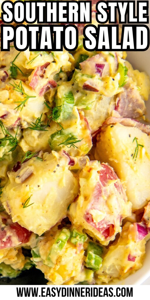 Creamy red potato salad with fresh dill and hard boiled eggs in a bowl.