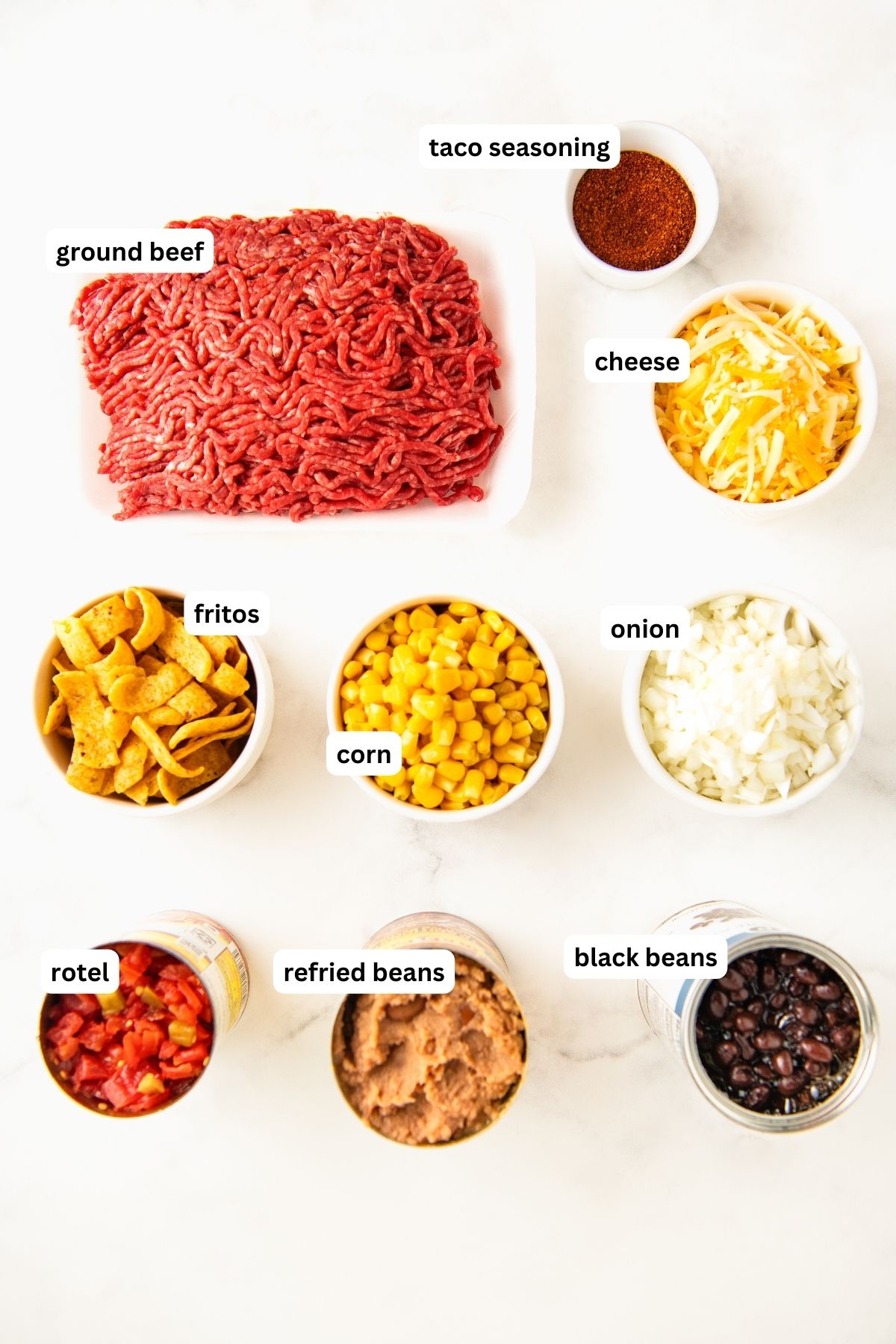 Labeled ingredients for taco casserole with Fritos. 