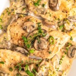 Tender and juicy chicken breasts and mushrooms in a creamy asiago cheese sauce topped with fresh herbs.