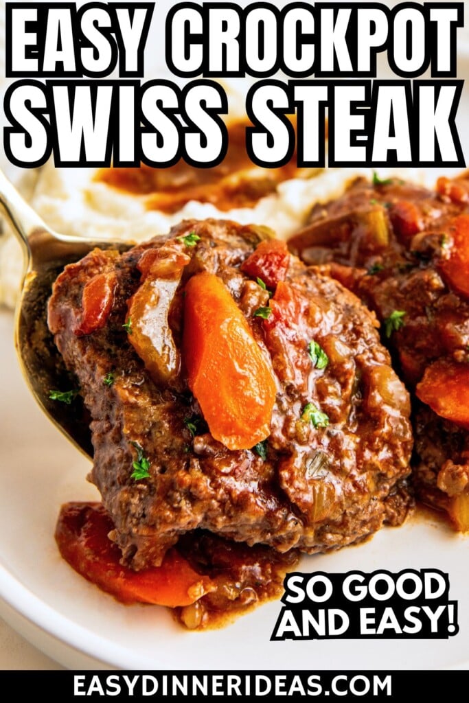 A serving spoon placing a tender crockpot Swiss steak with gravy on a plate.