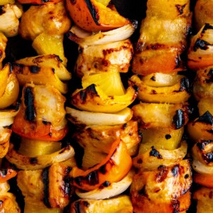 Close-up of pineapple chicken kabobs with peppers, onions, and sweet pineapple.