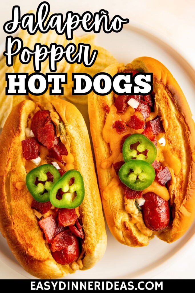 Jalapeño Popper Hot Dogs are stuffed hot dogs with a creamy jalapeño popper filing topped with crispy bacon and lots of cheese on a plate with a bite taken out of one hot dog.