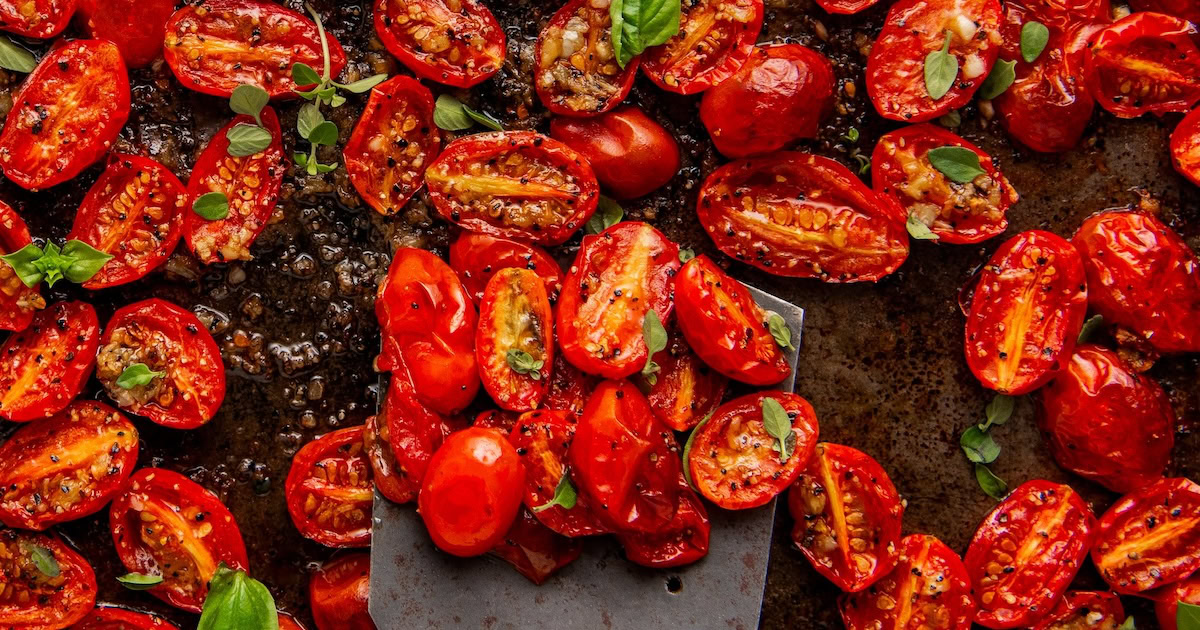 Landscape photo of roasted cherry tomatoes.