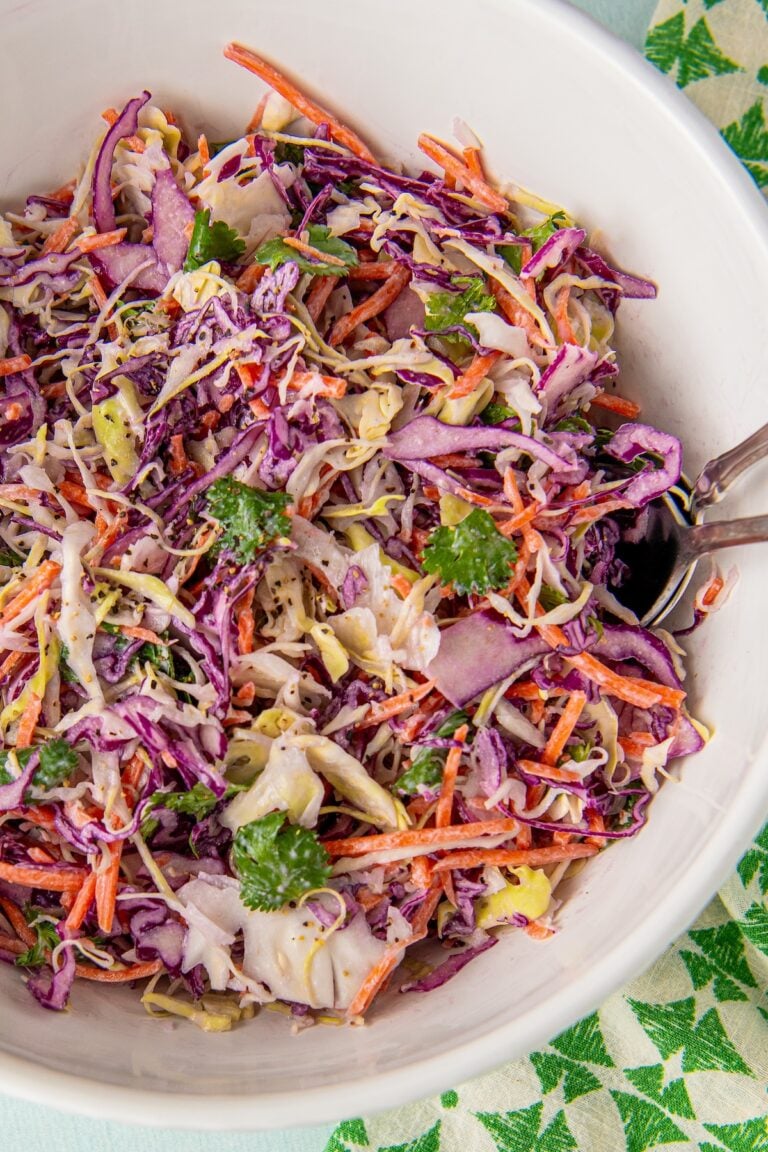 Fish taco slaw is tossed in a large mixing bowl.