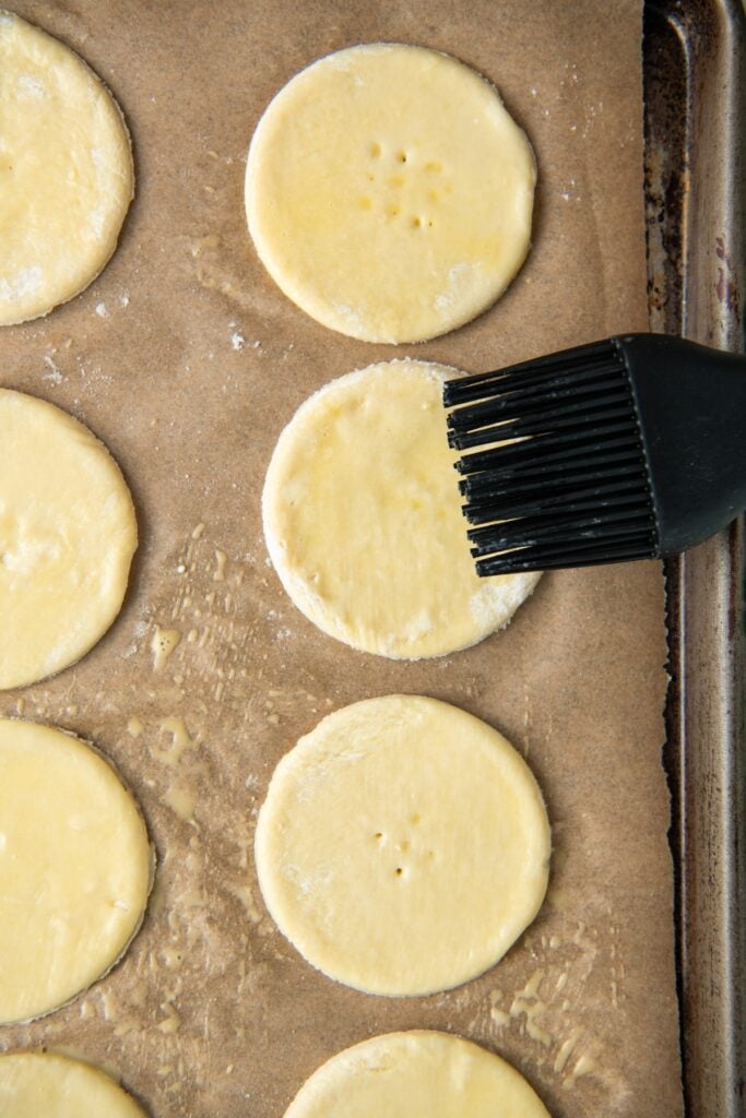 Puff pastry is prepared on a baking sheet.