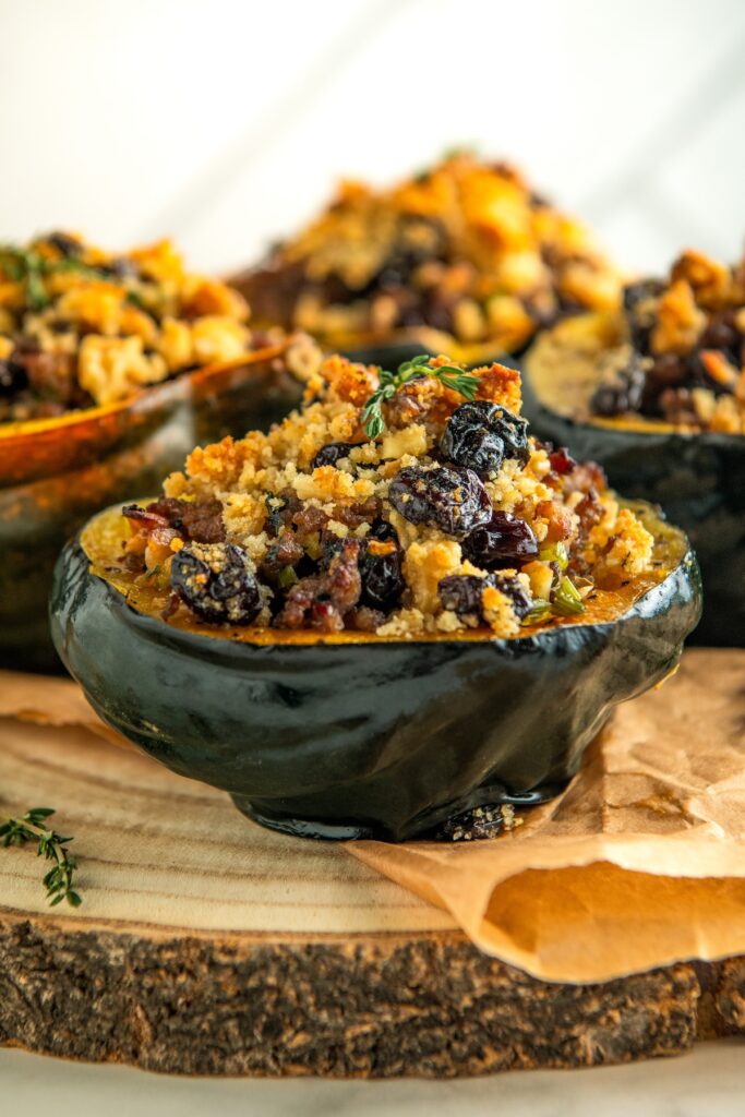 Acorn squash halves stuffed with sausage mixture.