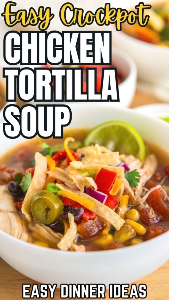 Easy crockpot chicken tortilla soup presented in a white bowl with lots of toppings.