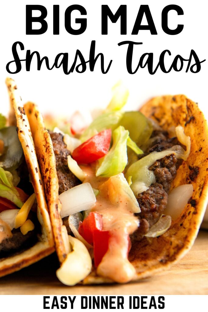 Close-up of two Big Mac smash burger tacos filled with ground beef, diced tomatoes, lettuce, onion, and a creamy sauce. The tacos are in a folded tortilla, showcasing the ingredients.