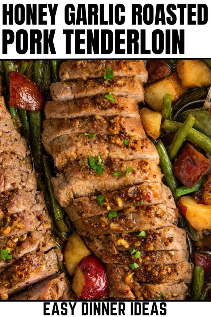 Sliced honey garlic roasted pork tenderloin with green beans and roasted red potatoes in a skillet.