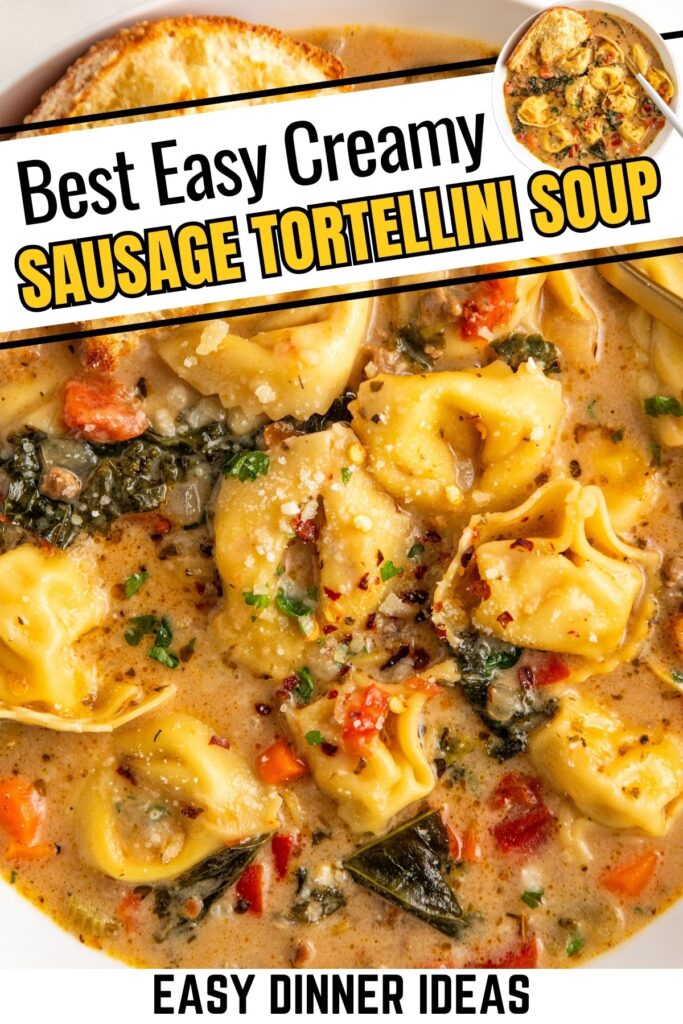 A bowl of creamy sausage tortellini soup, garnished with herbs and red pepper flakes. The soup includes tortellini, sausage, and greens in a creamy broth. A slice of toasted bread rests on the side.