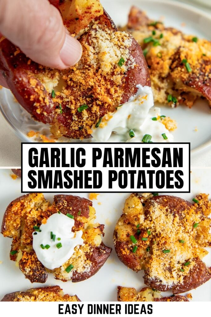 A close-up of crispy garlic parmesan smashed potatoes topped with parmesan, garlic, herbs, and a dollop of sour cream.