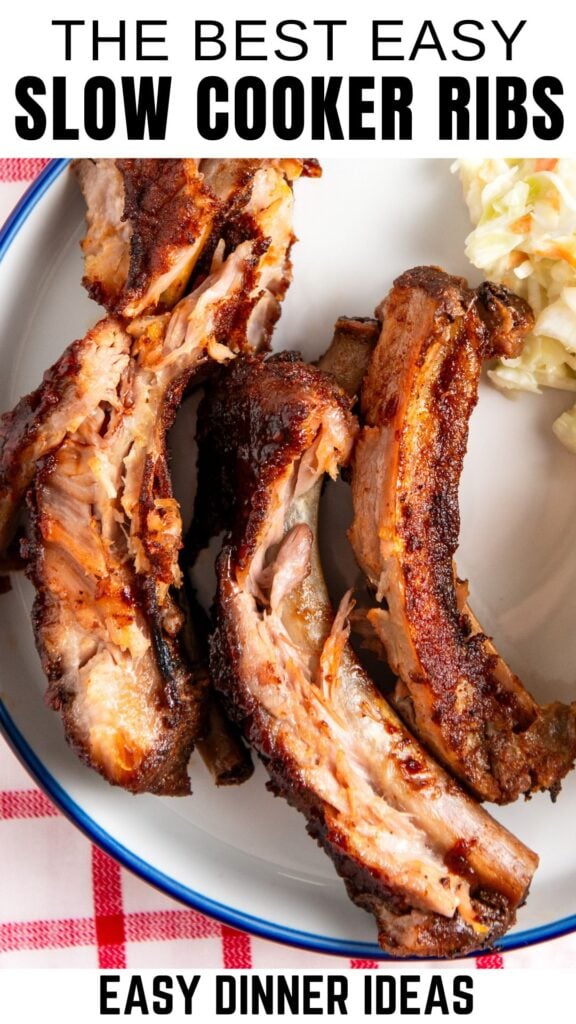A plate with tender, cooked slow cooker ribs and a side of coleslaw, shown from above.