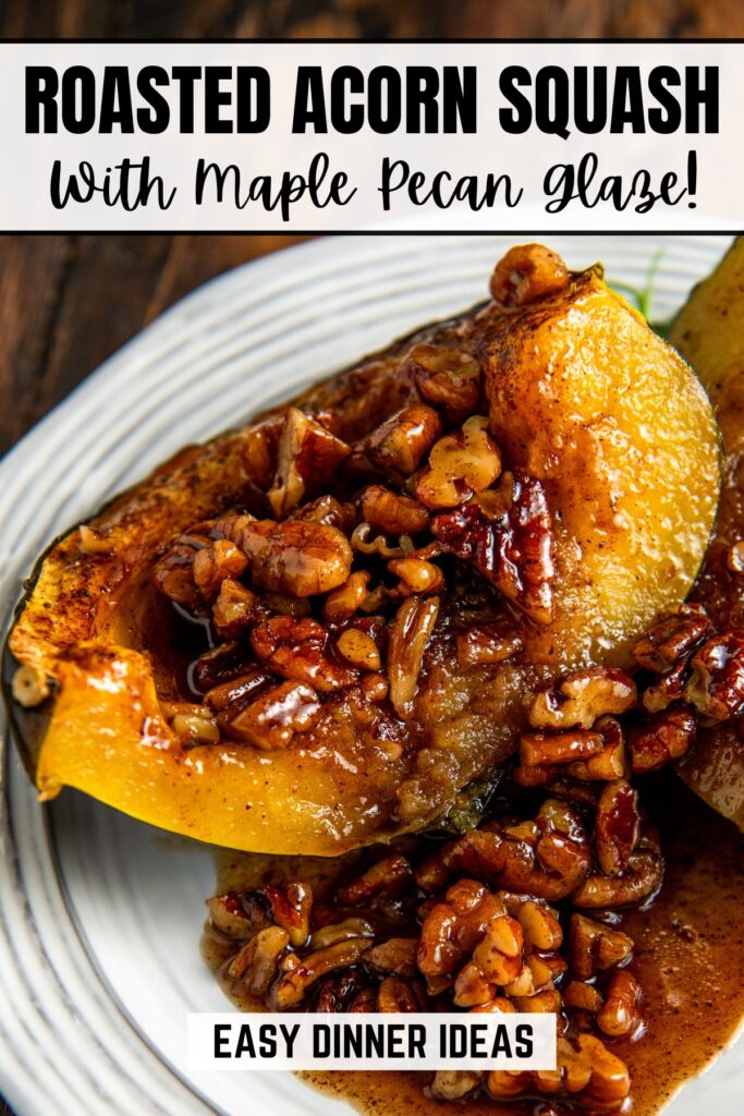 Close-up of baked acorn squash slices topped with a maple pecan glaze on a white plate.