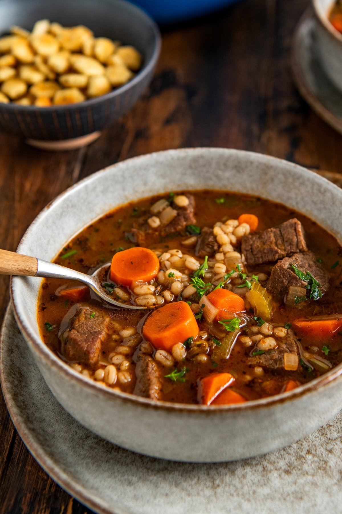Made easy in one-pot, Beef Barley Soup is loaded with tender beef, chewy pearl barley, and lots of vegetables in a rich and savory broth. A bowl of beef barley soup with chunks of beef, carrots, celery, and barley in a rich broth, served with a spoon.