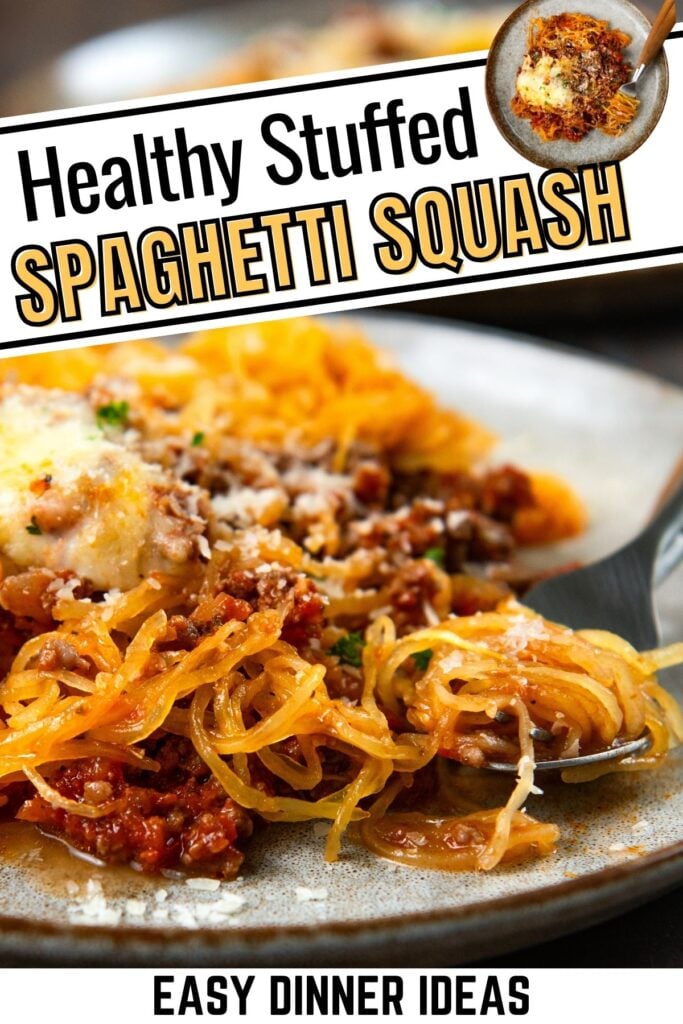 Close-up of stuffed spaghetti squash with a tomato-based meat sauce, melted cheese, and herbs on a plate, with a forkful in the foreground.