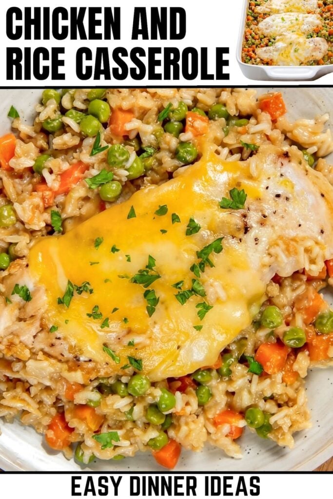 A close-up of a cheesy chicken and rice casserole with peas and carrots, topped with melted cheese and chopped parsley, on a white plate.