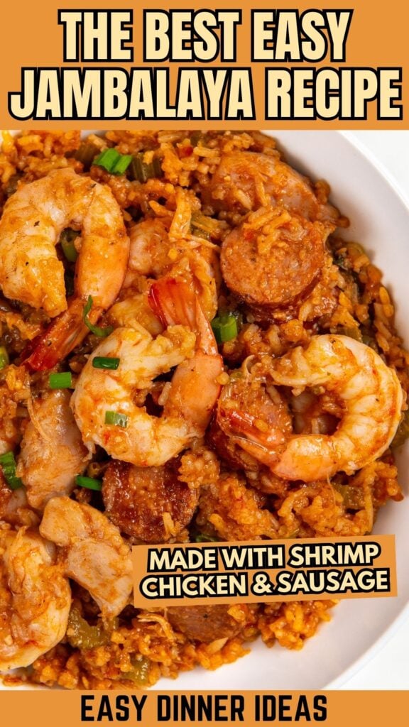 Close-up of a bowl of cajun jambalaya with shrimp, chicken, sausage, rice, and garnished with green onions.